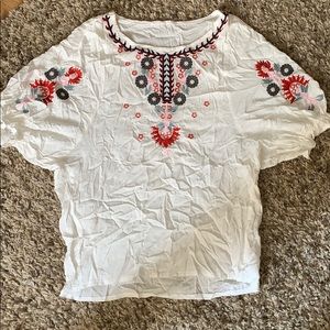 White blouse with floral embroidery